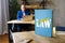 Lawyer holds LABOUR LAW book. Labour lawÂ mediates the relationship between workers, employing entities, trade unions and the